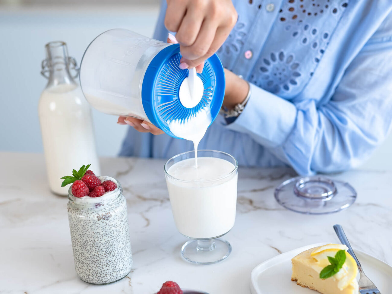 A person pouring milk into a glassAI-generated content may be incorrect.